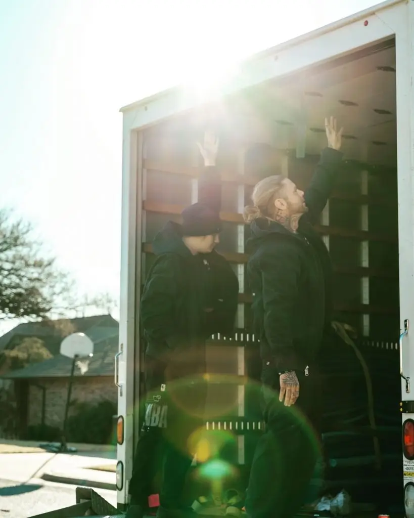 two movers opening a moving truck near edmond oklahoma